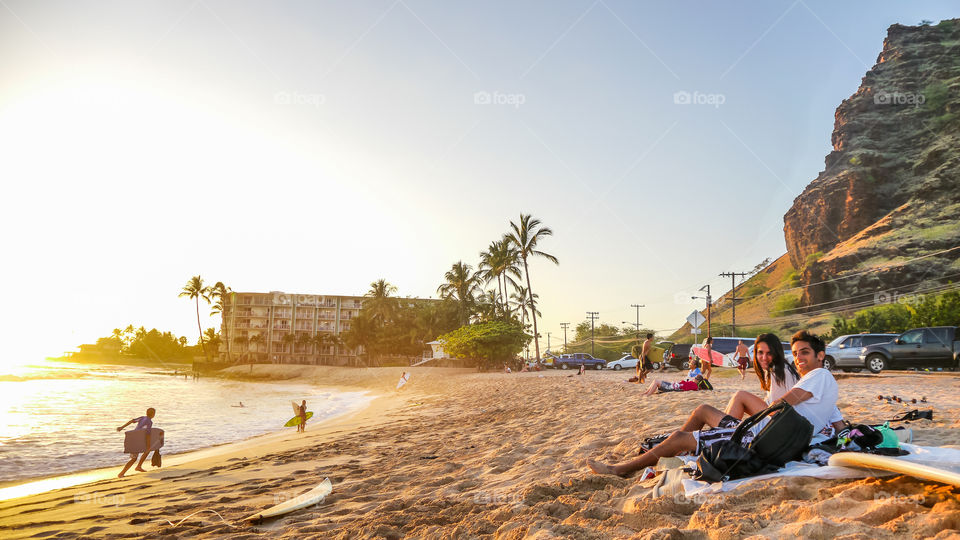 Happy people at the beach. Makaha beach sunset Hawaii Oahu island