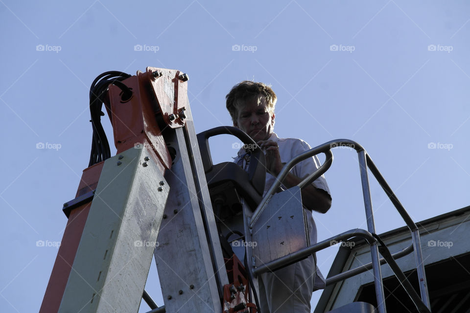 Man in a work bucket Fairhope Alabama