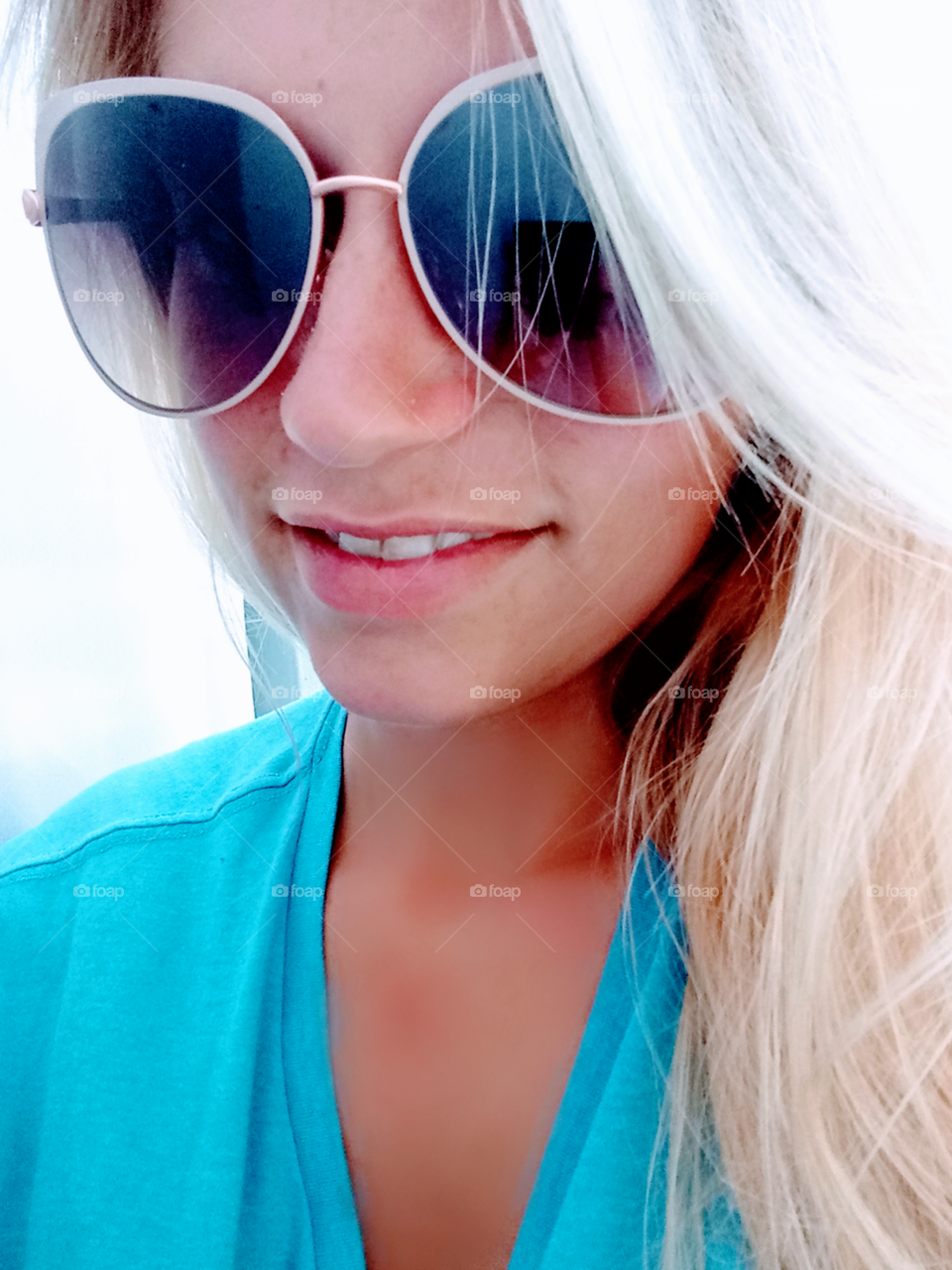 hot young blond wearing sunglasses