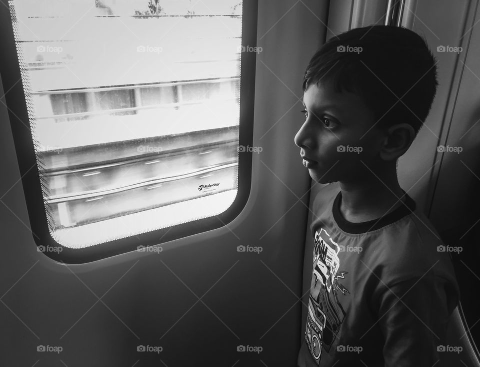 Boy standing in train