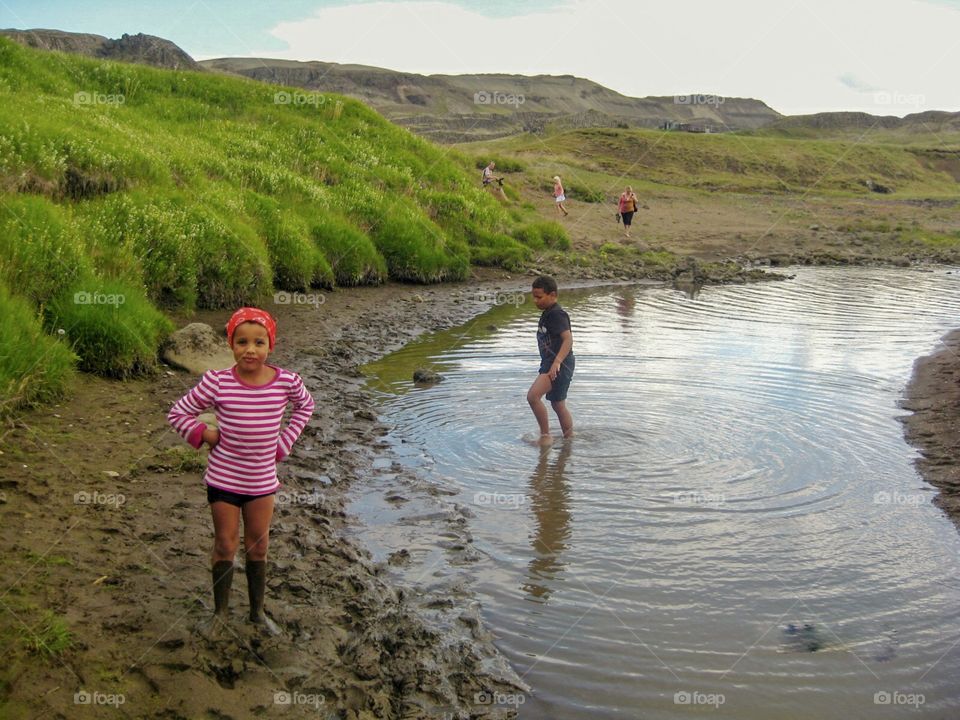 Playing on the beach getting dirty.  This is what kids do.   