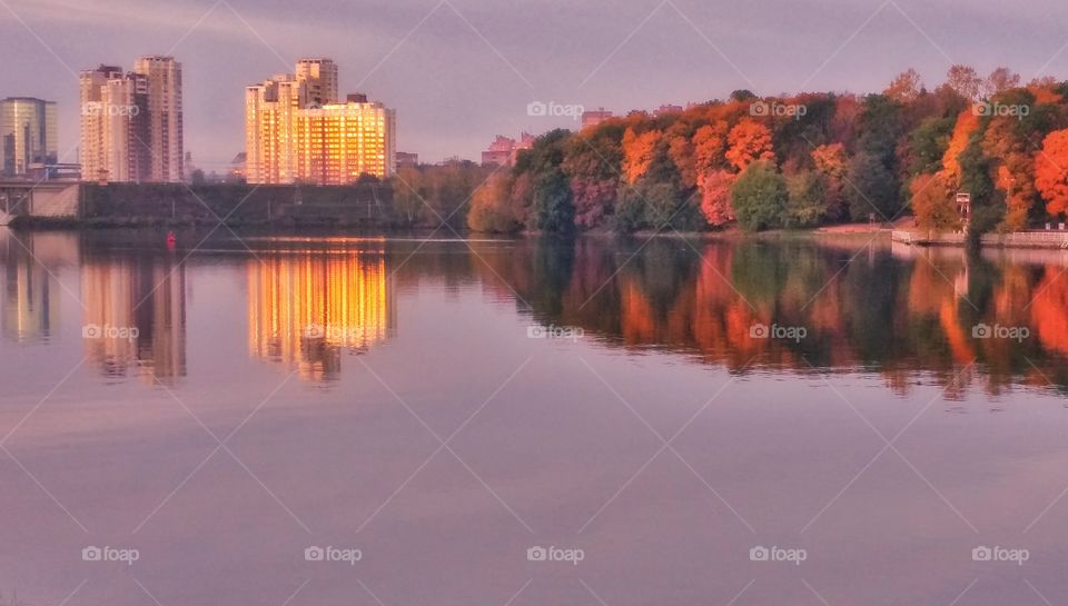 Autumn trees reflecting in lake