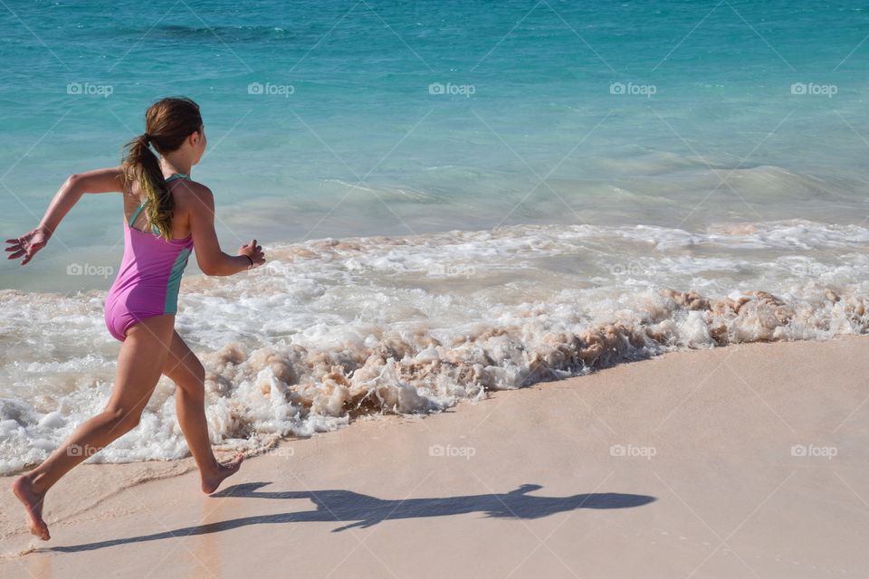 Girl Running on the Beach