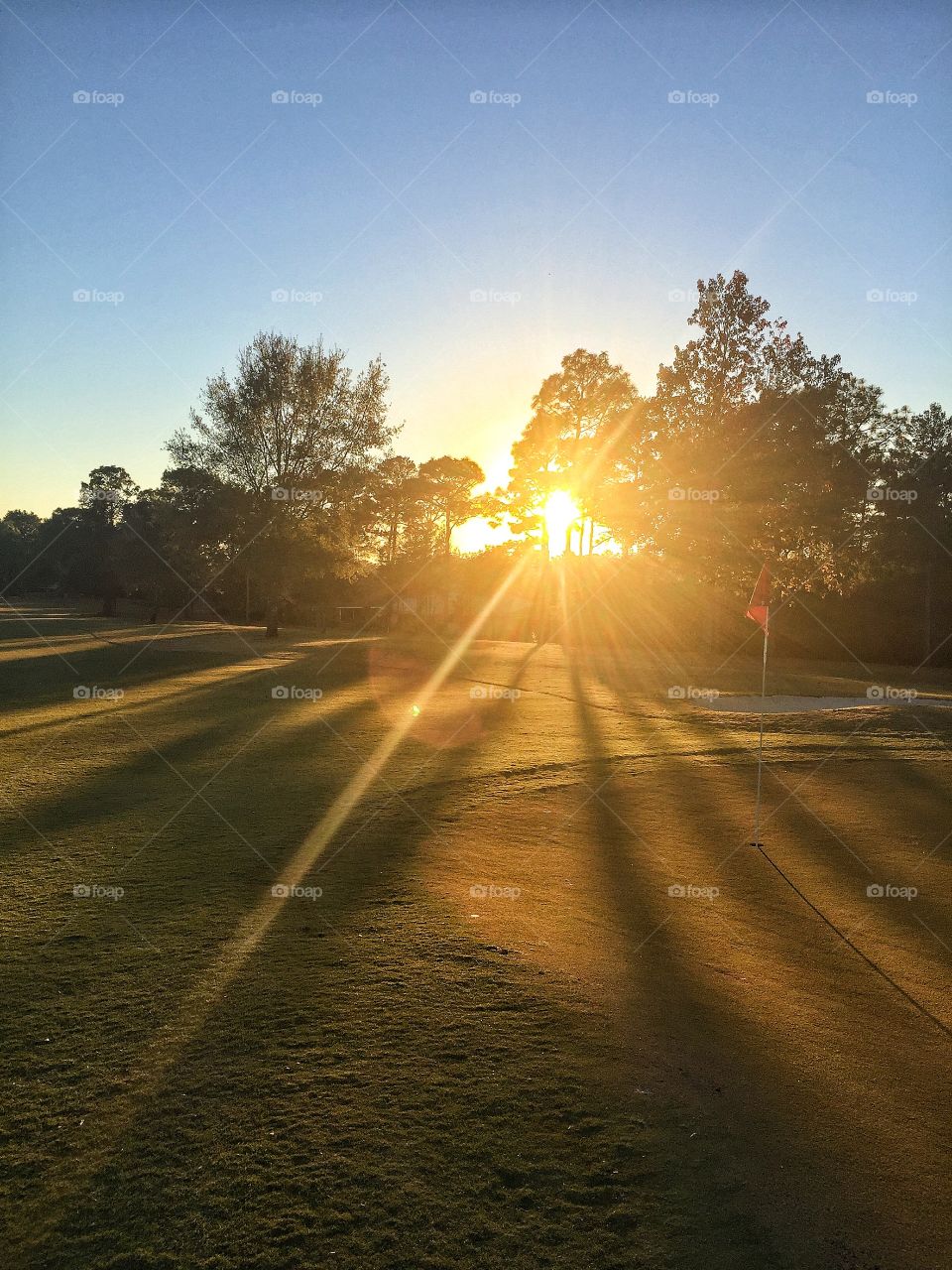 Impressive su rays in the golf course 