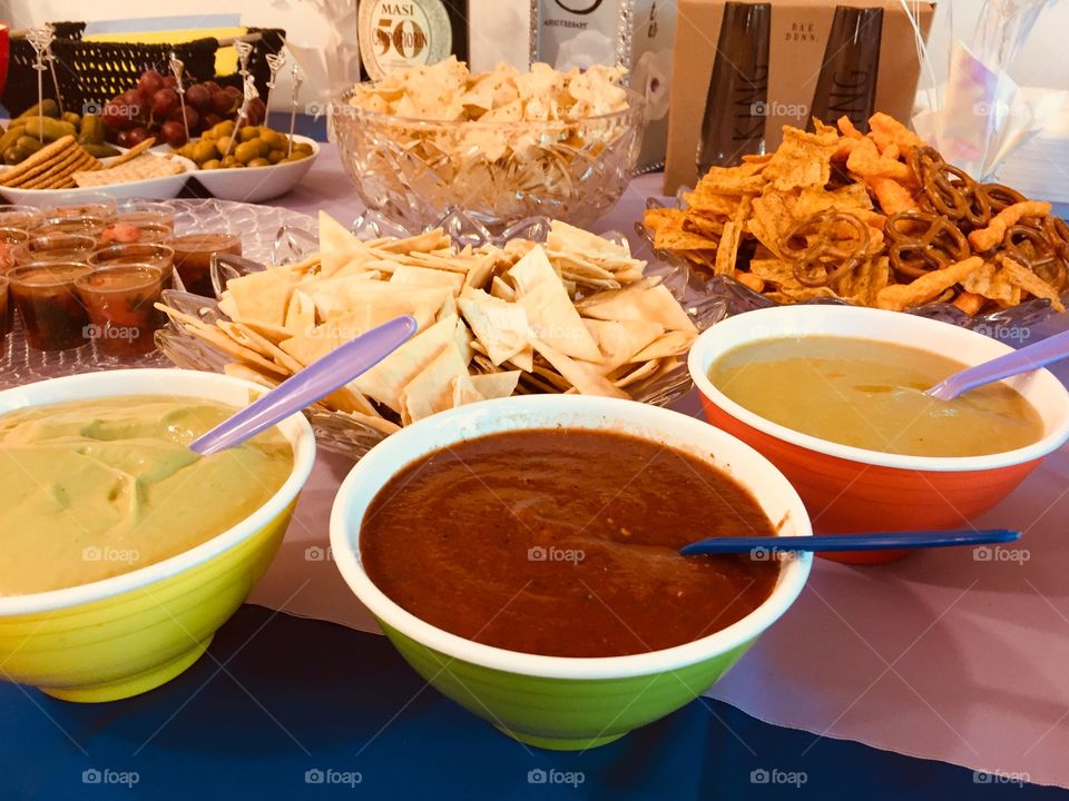 Party dips. Guacamole, red salsa and salsa verde served with baked corned chips 