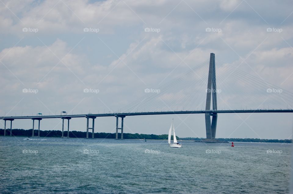 Sailboat Under Bridge