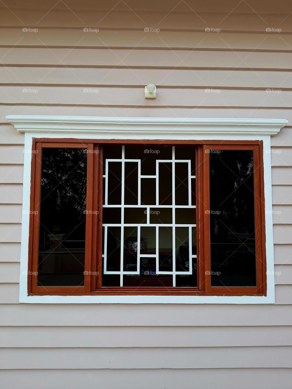 Window with wrought iron grill