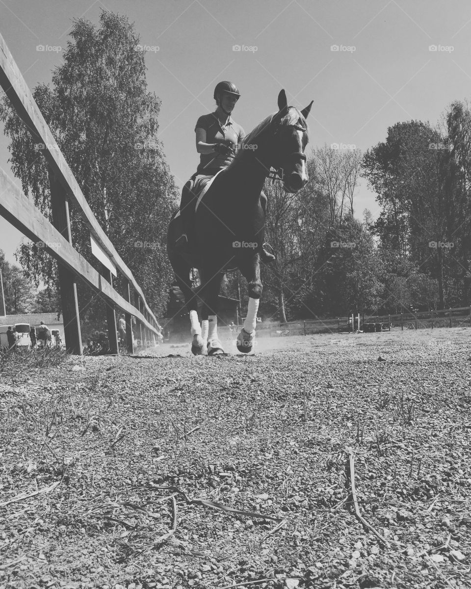 Woman riding her horse