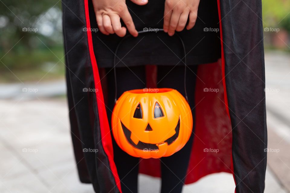 Happy kid celebrating Halloween outdoor 