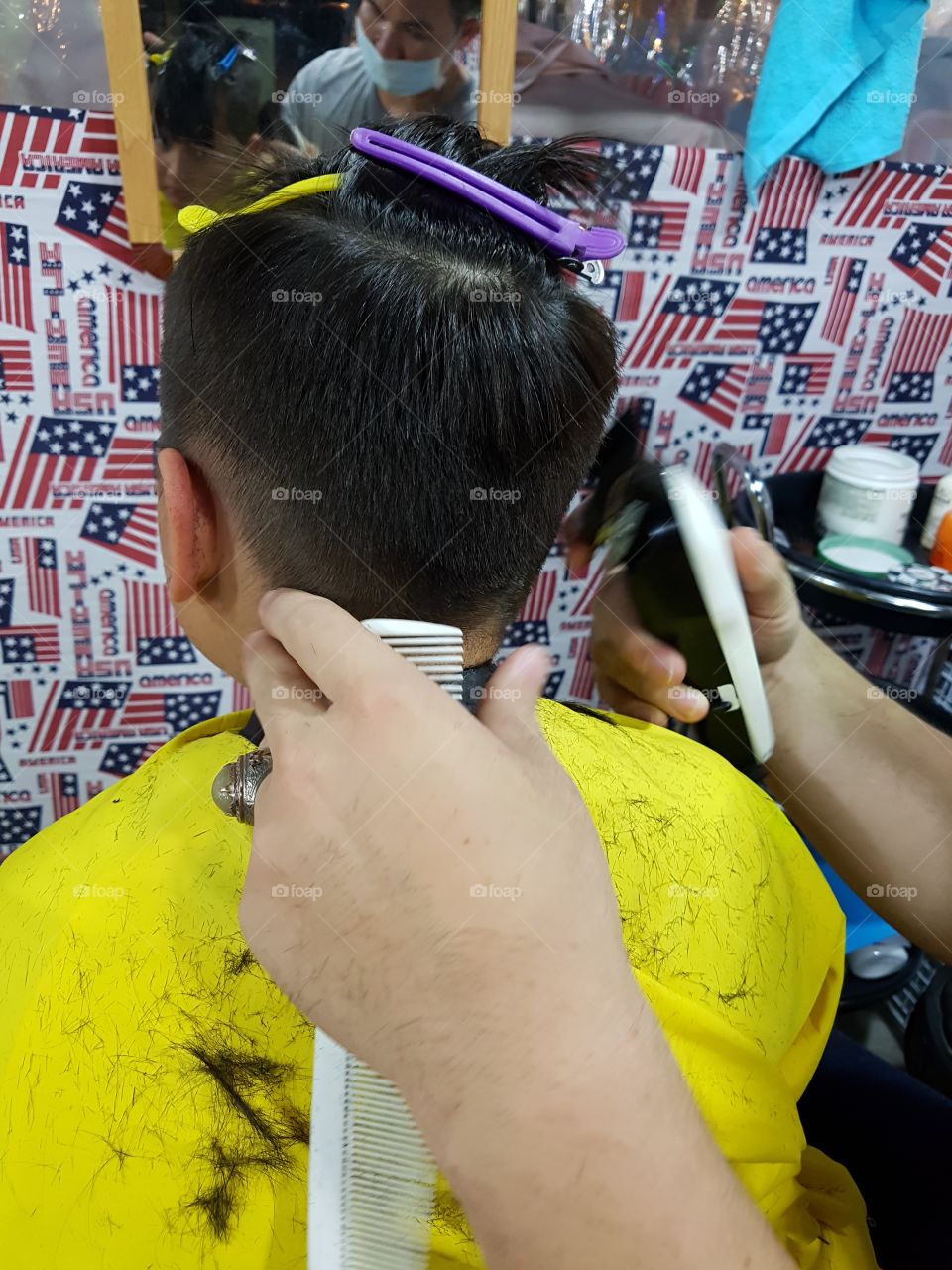 young boy having haircut