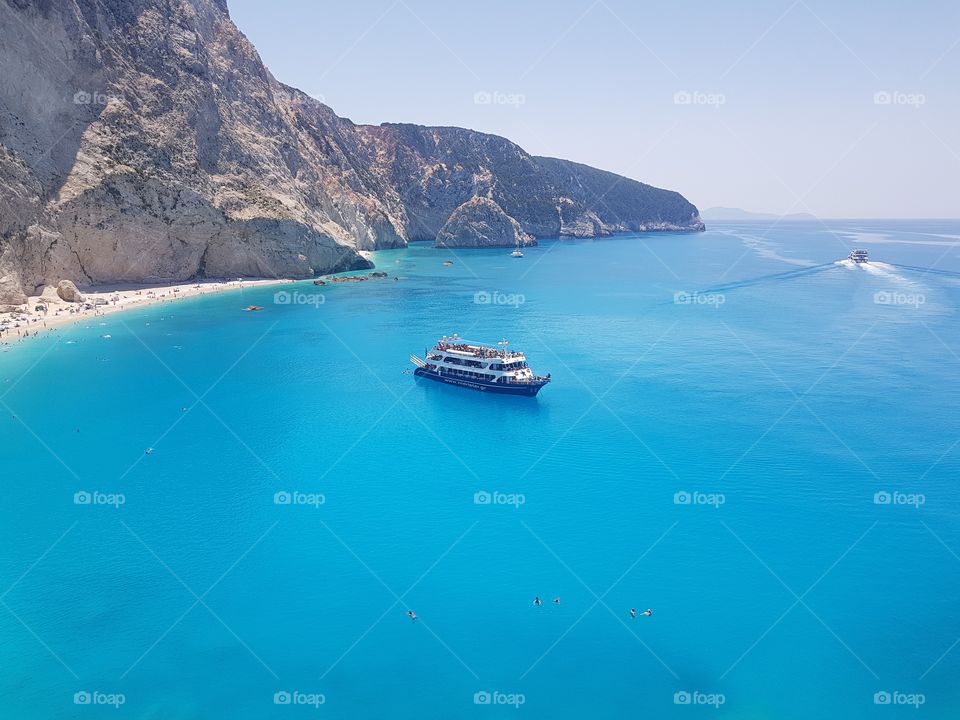 Porto Katsiki Lefkada. Beautiful blue water with big ship in the centre of picture.