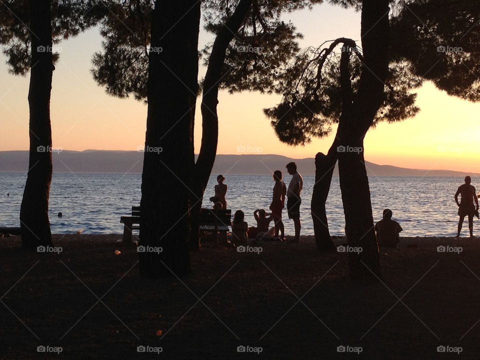 beach people sunset trees by cabday