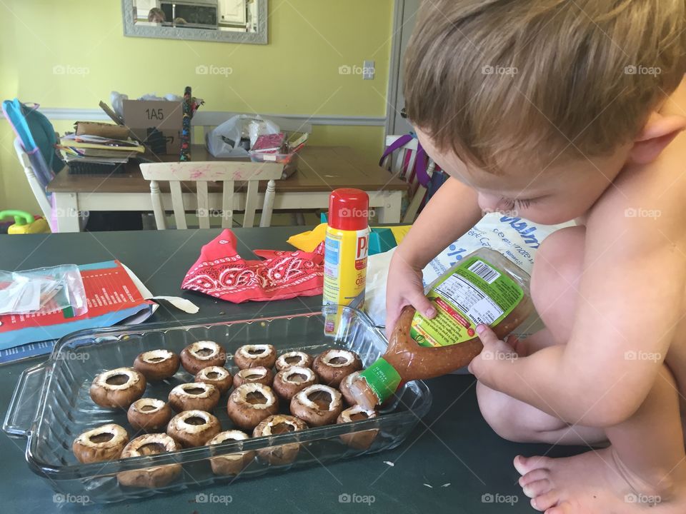 First step: Fill mushrooms with Italian dressing. 