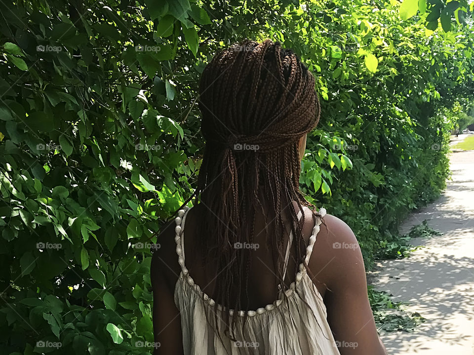 Woman hairstyle on greenery background 