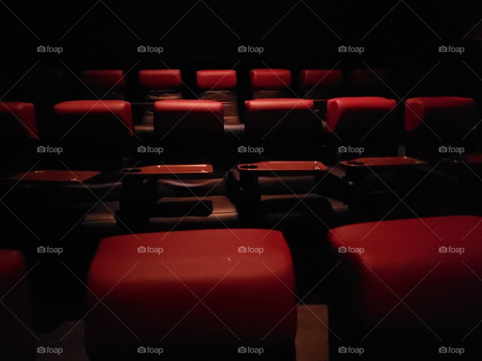 Artificial light:  Red empty movie theater seats