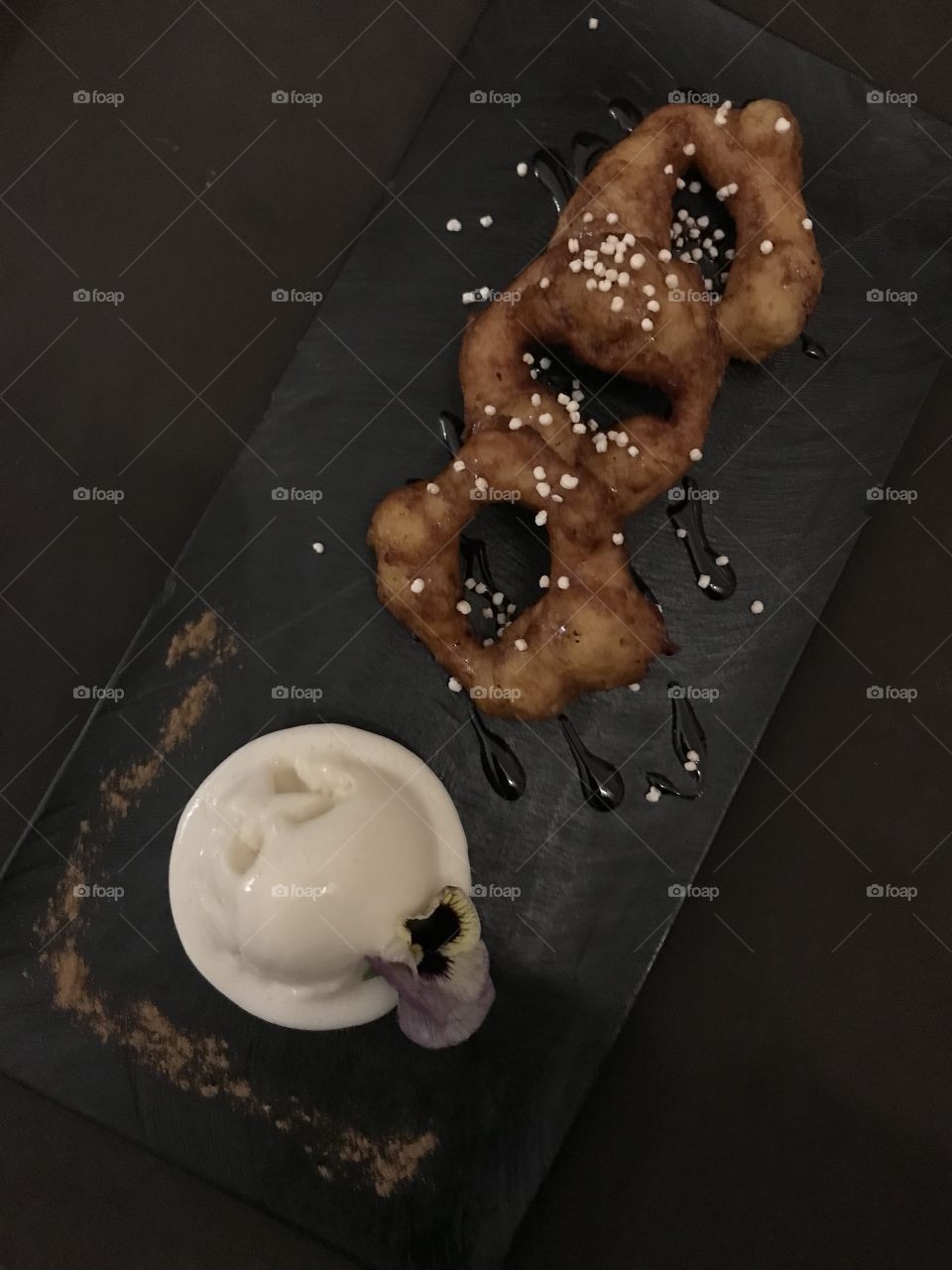 Pumpkin and sweet potato donut rings dipped in sugar cane glaze with a side of vanilla ice cream!