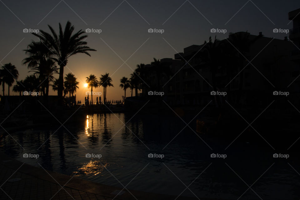 Alcudia Pins hotel and resort in Alcudia Majorca, view over pool area at sunrise at summer.