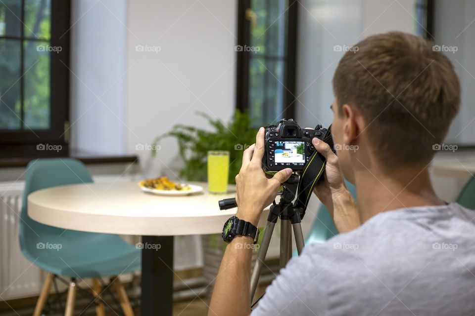 Man taking pictures of food. Artist during the creation process 