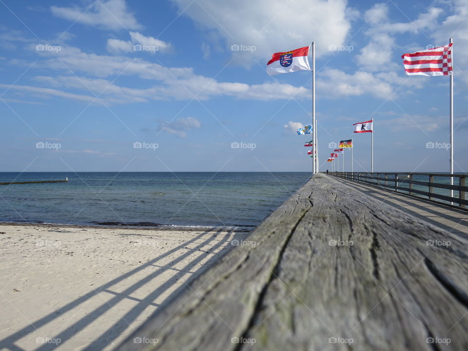 Beach, flags and the ocean