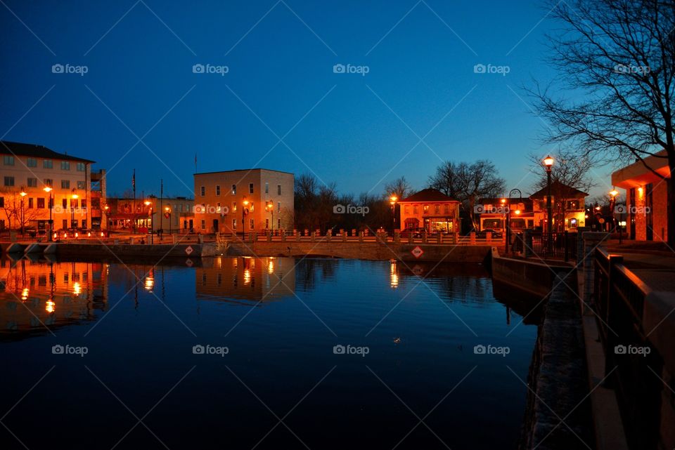 Reflections at falls. Shot at Menomonee Falls at dusk by the damn is a panoramic 