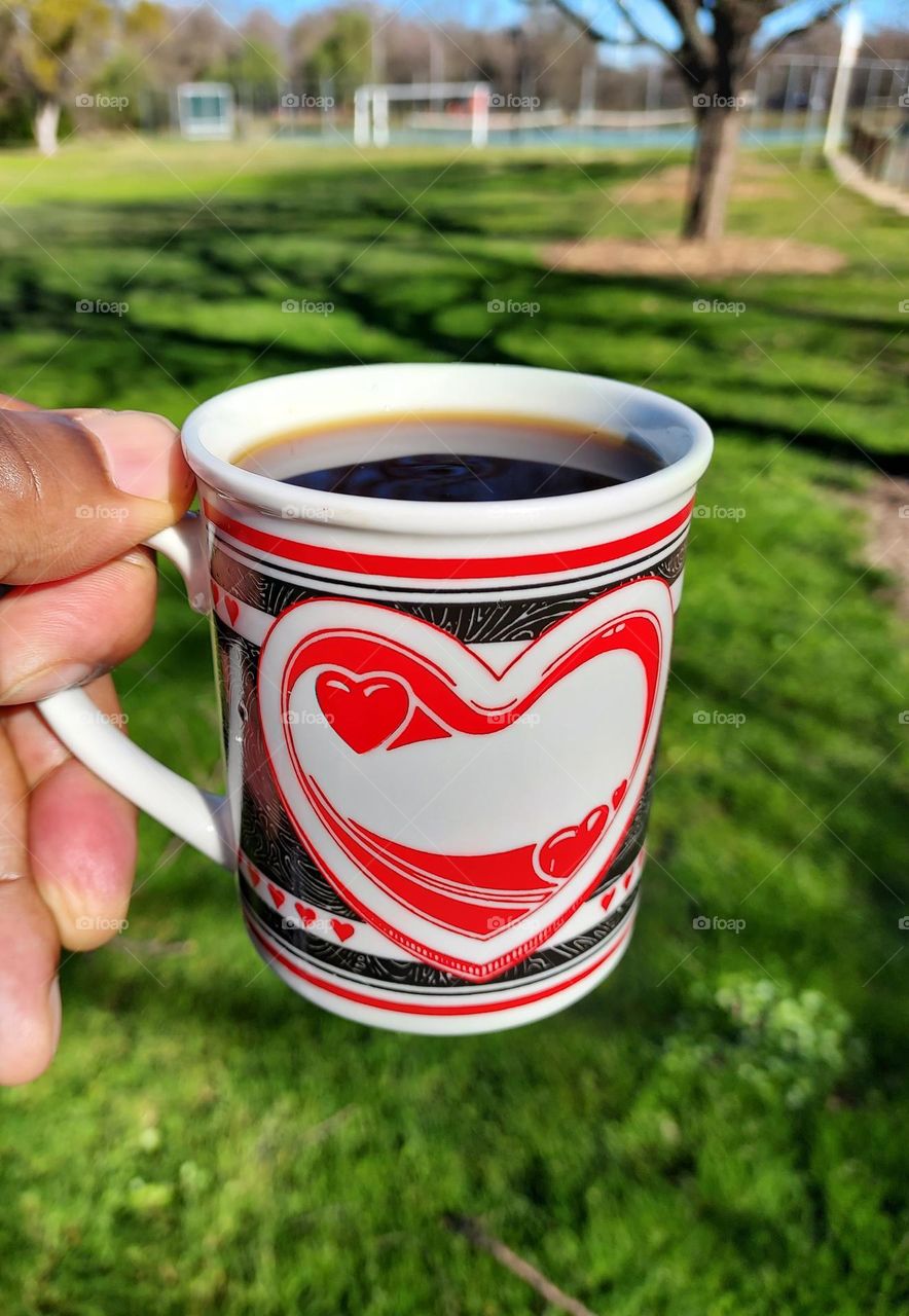 Having a delicious cup of coffee at the park in the great outdoors