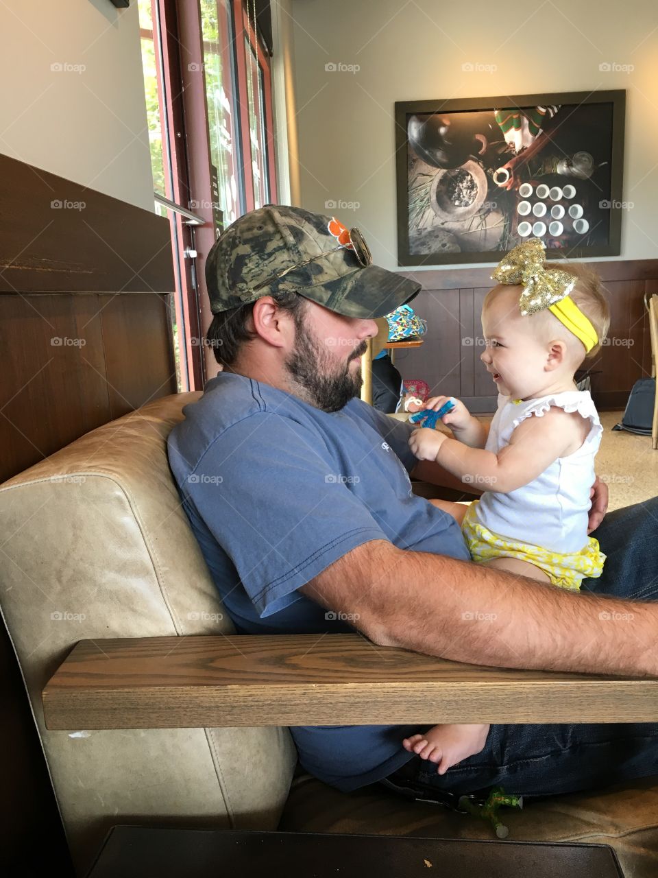 Father and daughter playing in house