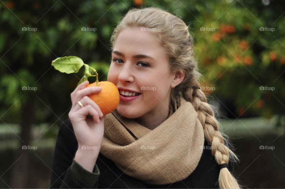 Portrait of a girl with an orange