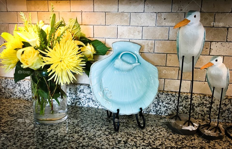 Teal and yellow...
Yellow flowers, teal shell serving dish, and teal beach sandpipers 