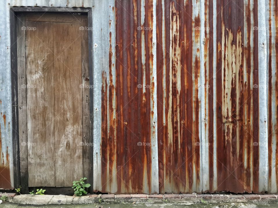 Old zinc fence with gate