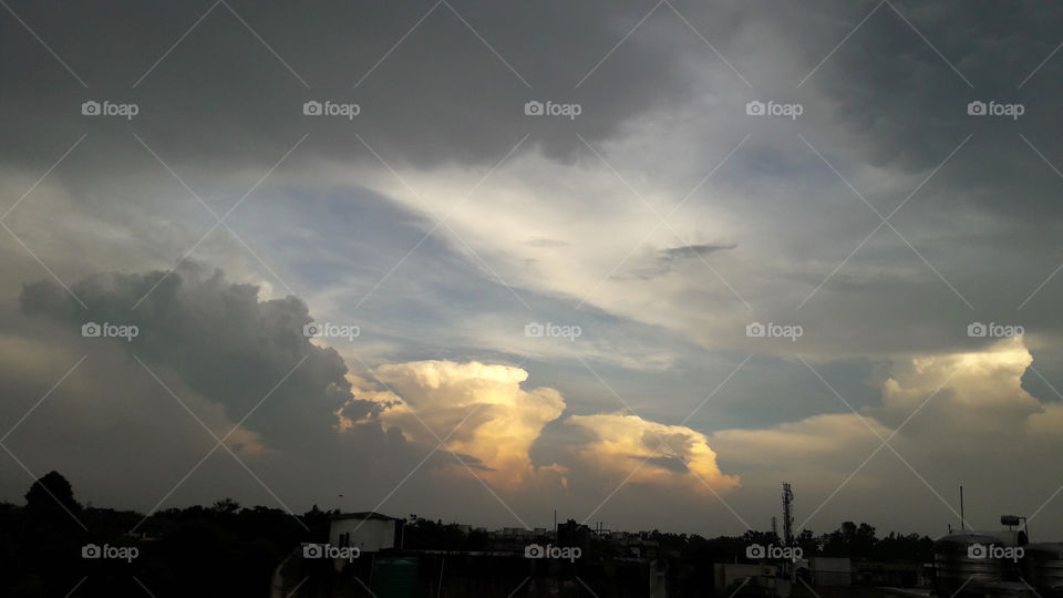 A wide warm smile in the cloudy evening skies.