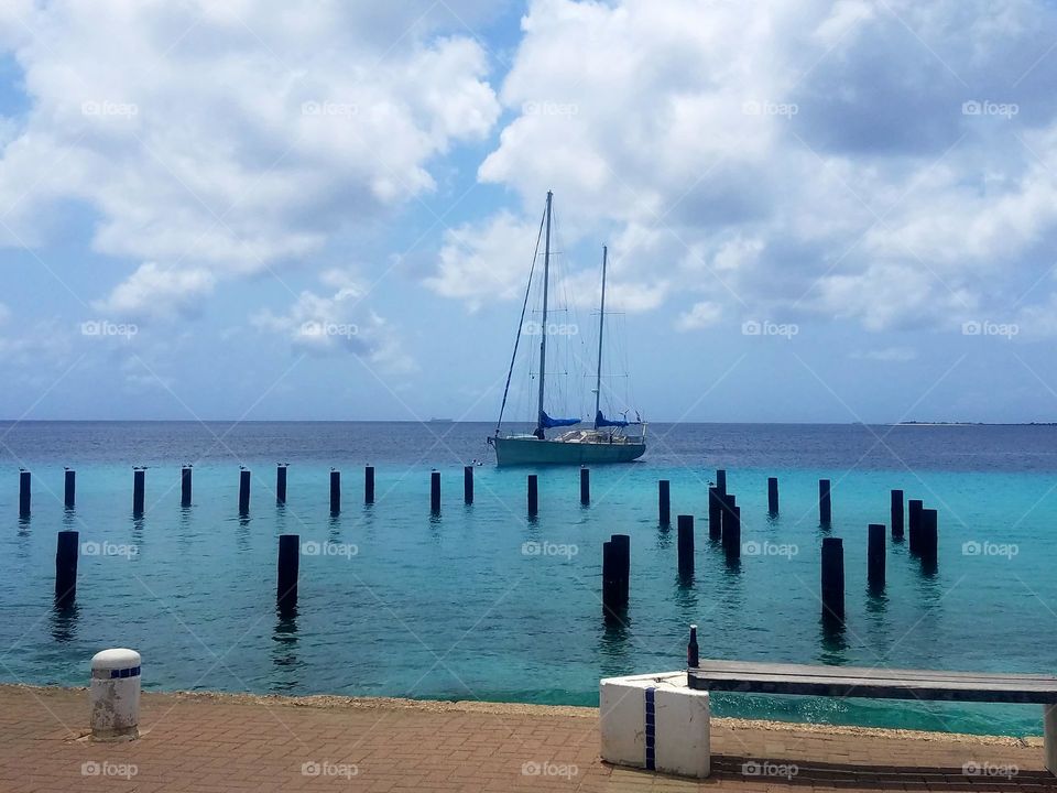 Blue Waters of Bonaire with Sailboat