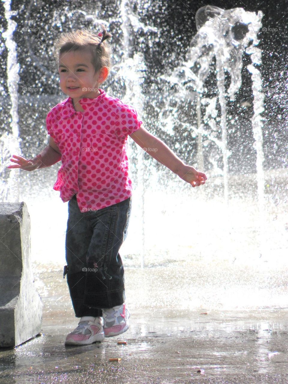 Little Girl Playing with water