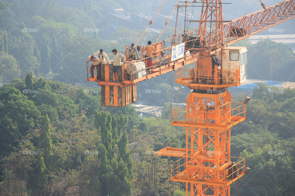 people working at height on the crane