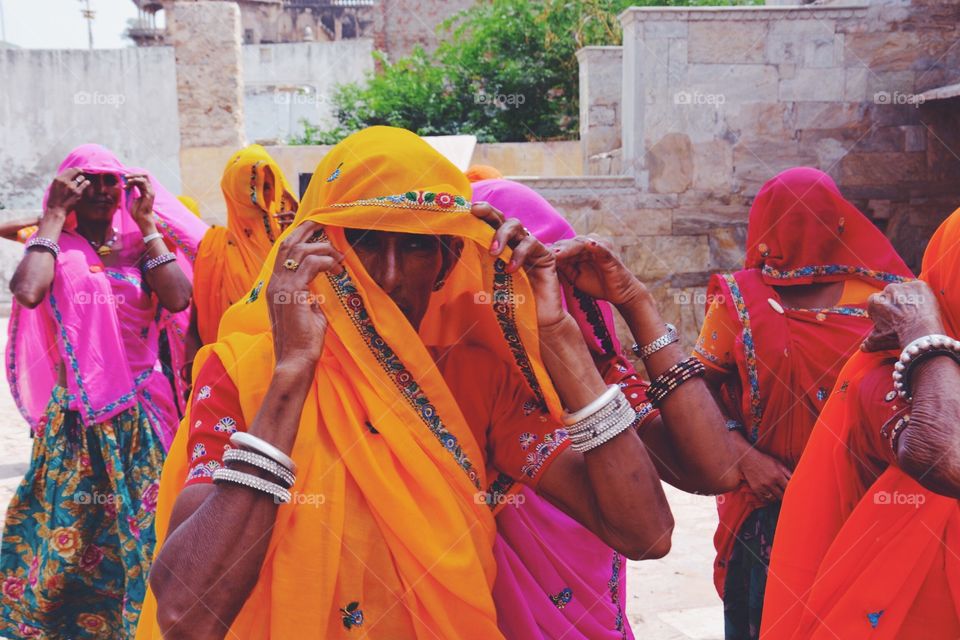 The village people . A local village of rajasthan . Where the loacal women are off from their homes in search of everyday domestic needs