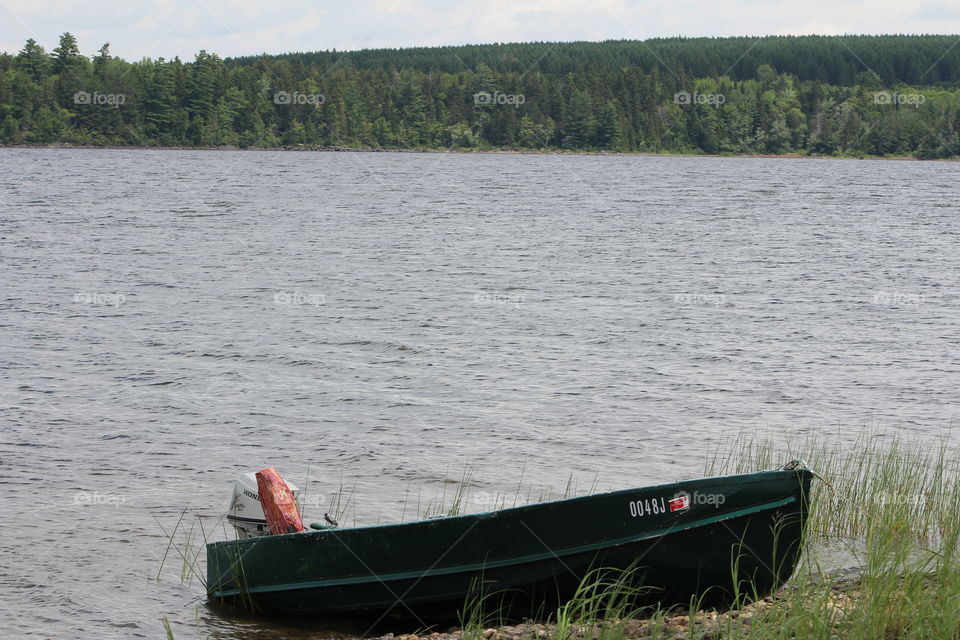 Rustic Motor Boat on pond