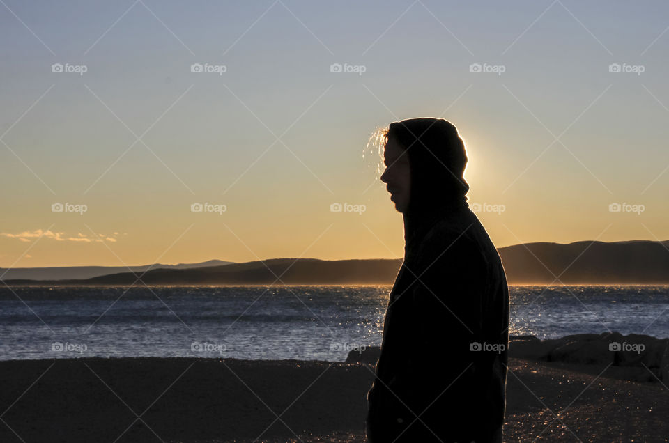 A young man on a beach