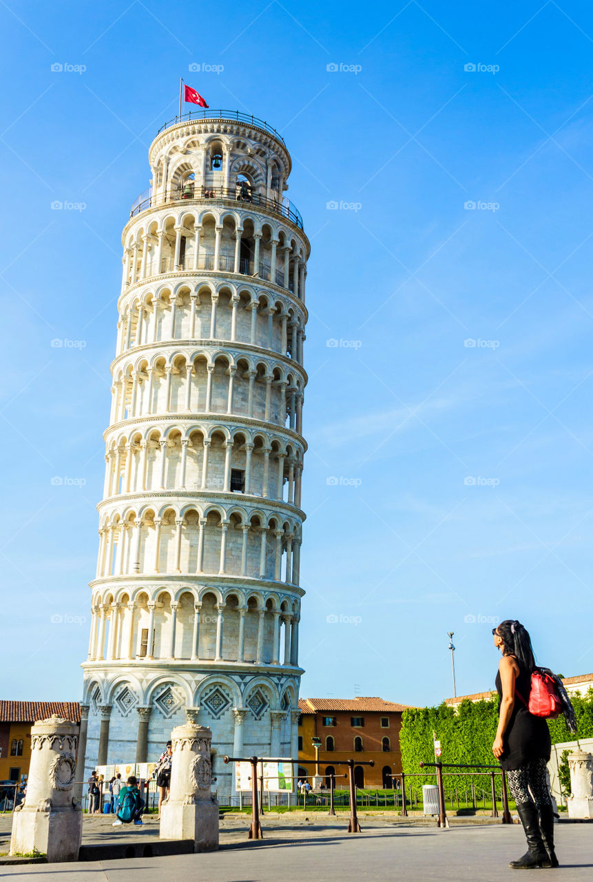 Woman looking at Leaning Tower Of Pisa, Italy
