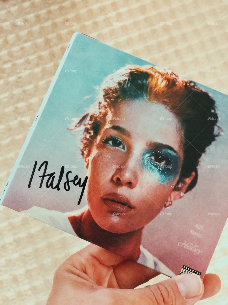 Signed Halsey CD, woman’s hand holding signed copy of CD, compact disc signed by artist Halsey 