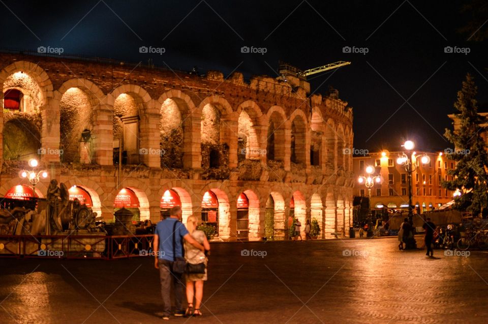 enjoying a stroll in piazza bra win the view of the arena Di verona 
