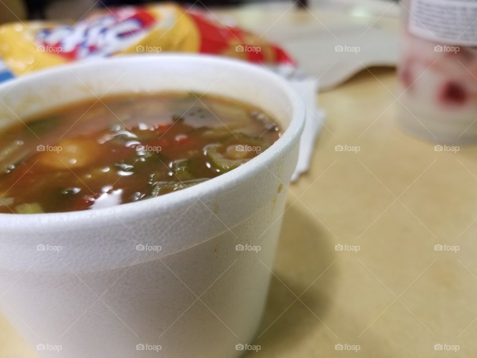 Eating Chicken Gumbo Soup with Fritos and A Strawberry Parfait. Creativity as a college student.
