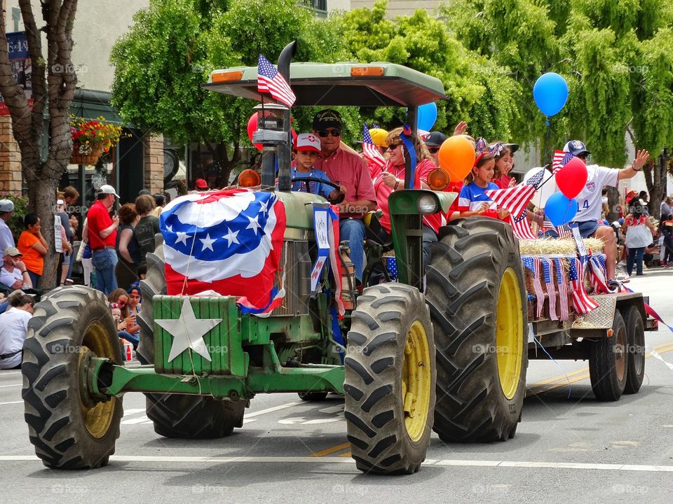 American Pride. American Farm Tractor In Fourth Of July Parade
