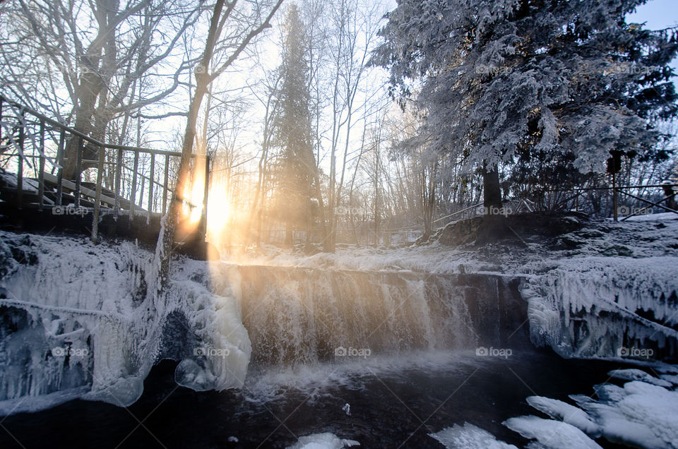 waterfall at winter sunrise