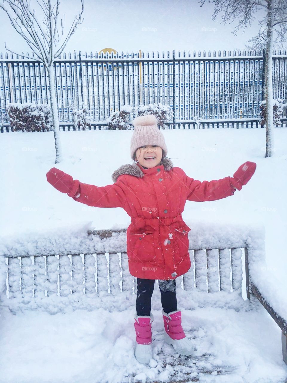 Children funning with snow