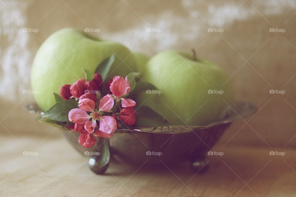 Green apple and flowers