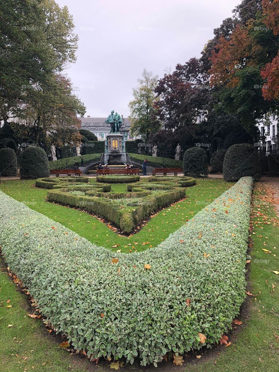 In the park, around the statue