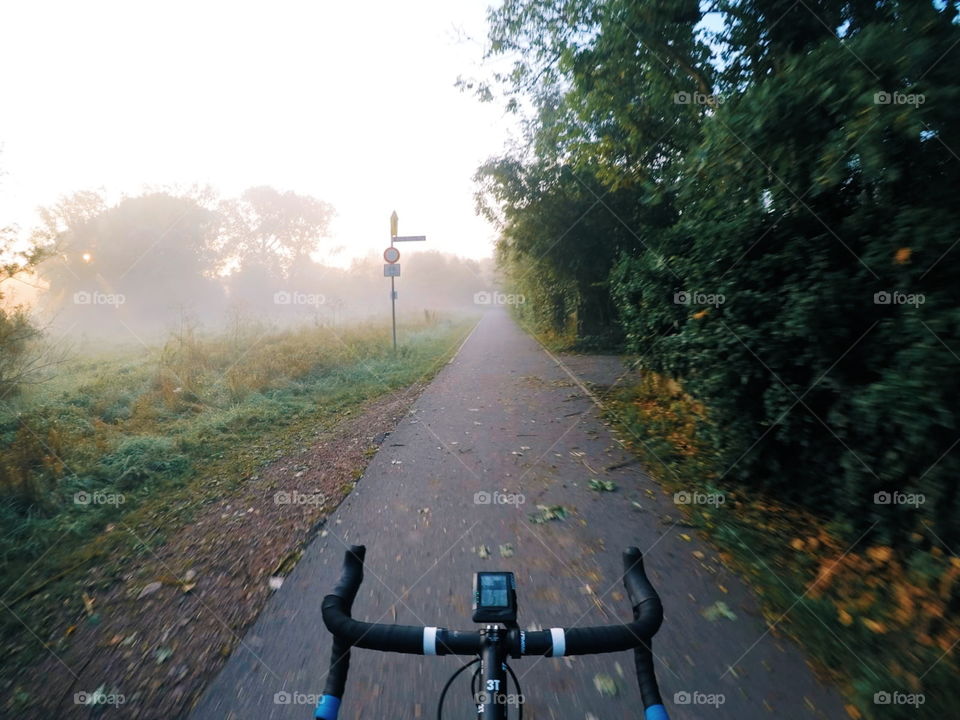 Foggy Morning ride with my roadbike. Looks like fall, but it's still summer. there are no people on the streets.