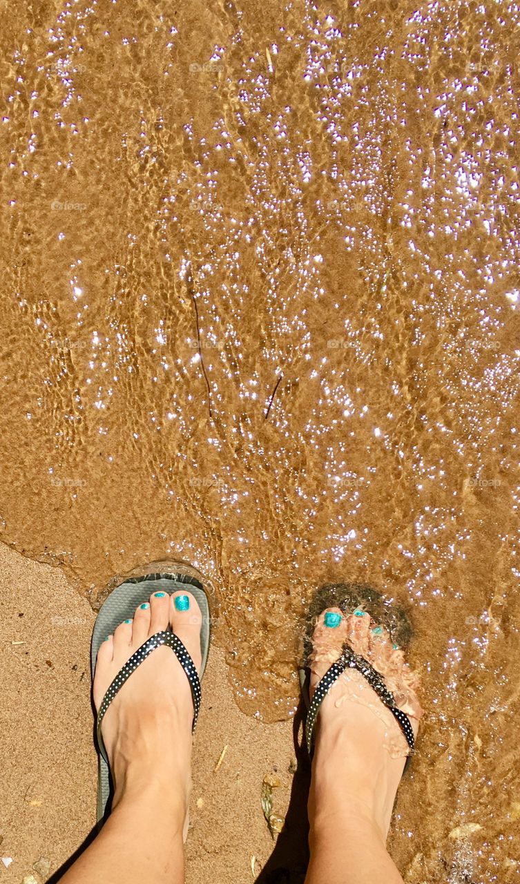 Hot Summer days need feet in the cool water. Toes. Feet water. Sand.