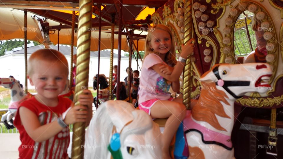 Children enjoying the carousel