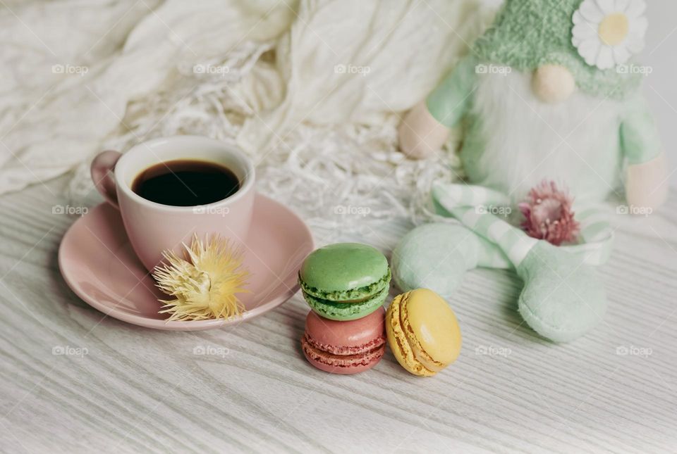 Coffee & macaroons with green gnome