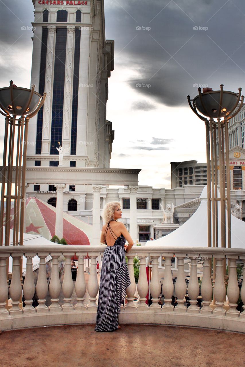 Pretty woman standing in balcony